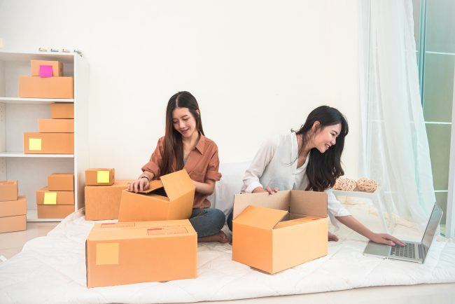 Two young Asian people startup small business