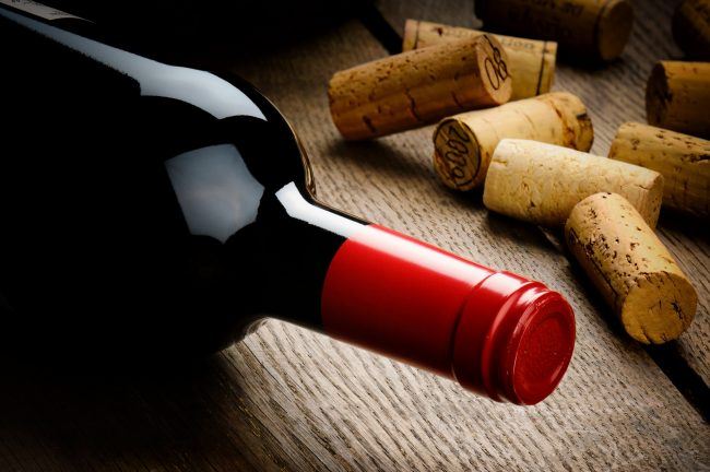 bottle of red wine and corks